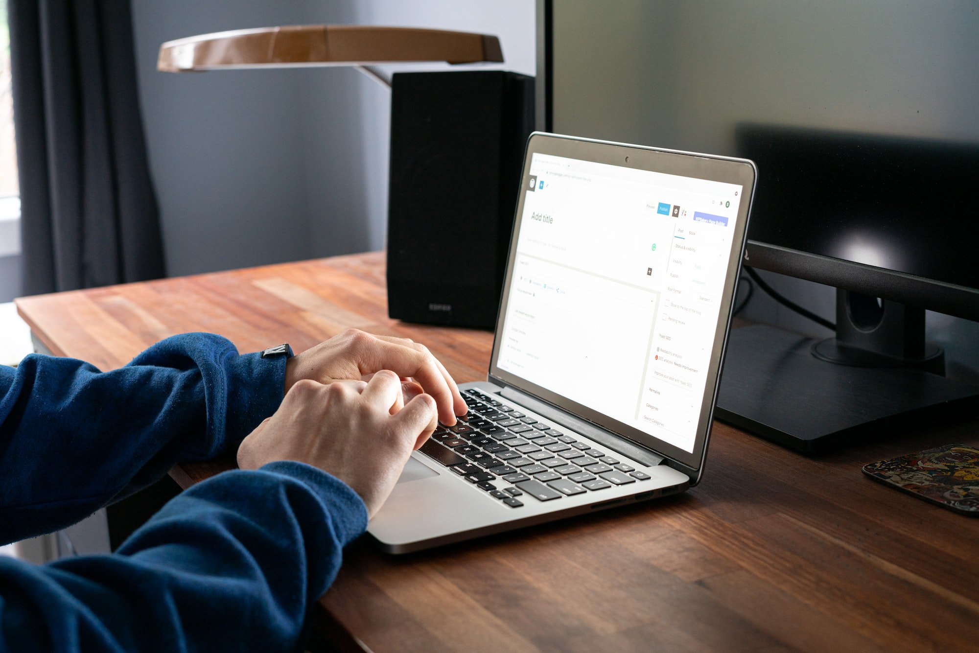 person typing at laptop